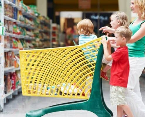mother and kids having fun playing grocery shopping games