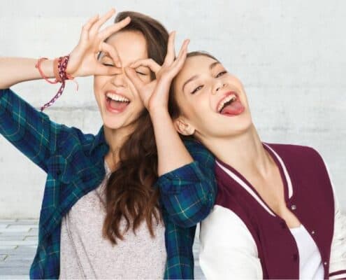 two young teen girls goofing off