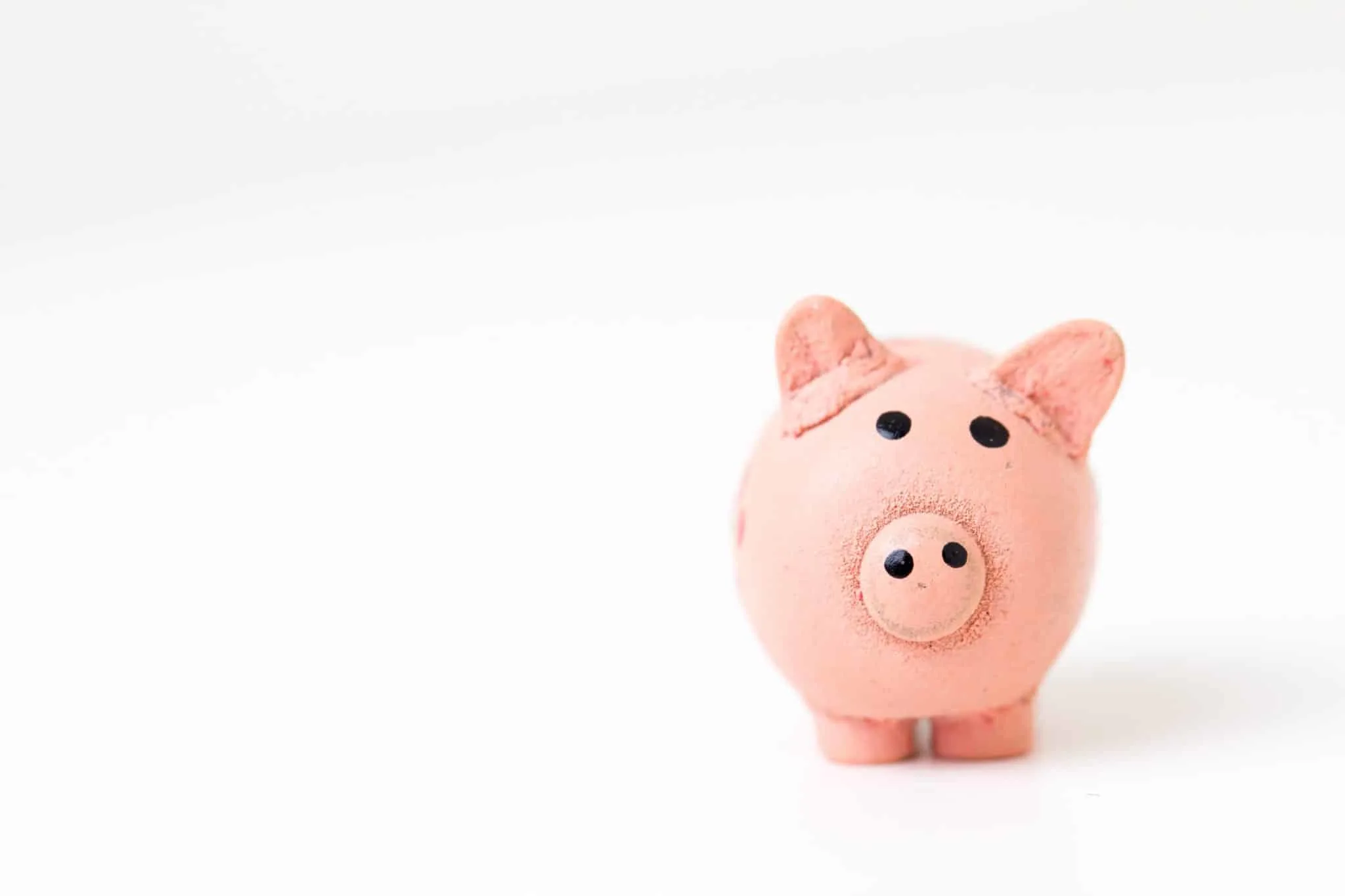 pink piggy bank for kids on white background