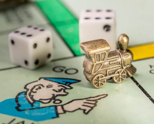 Train monopoly piece on go to jail space