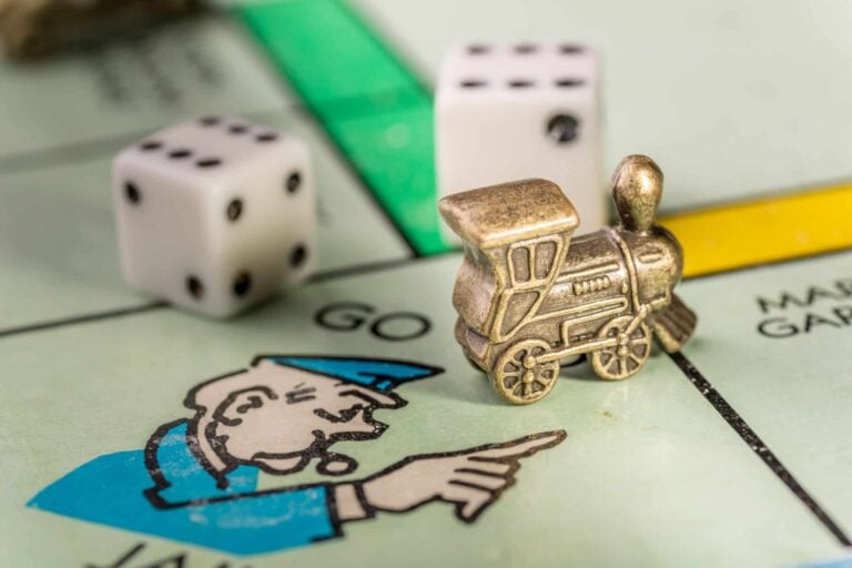 Train monopoly piece on go to jail space