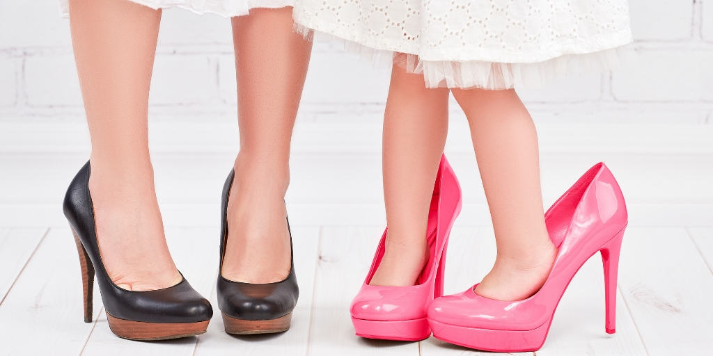 shows mother and daughter's feet in beautiful, adult-sized, high heels, ready for take your child to work day