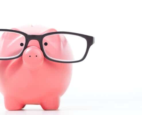 piggy bank with black glasses on it