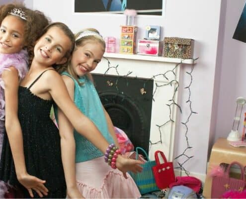 group of tween and teen girls having a party, smiling