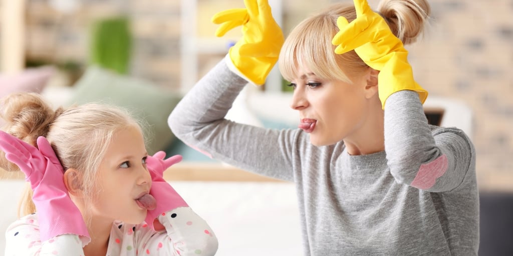 mother and daughter working on chores for kids and being silly