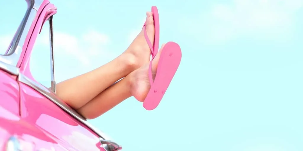 girl legs in pink flip flops, hanging out of a pink car - new driver