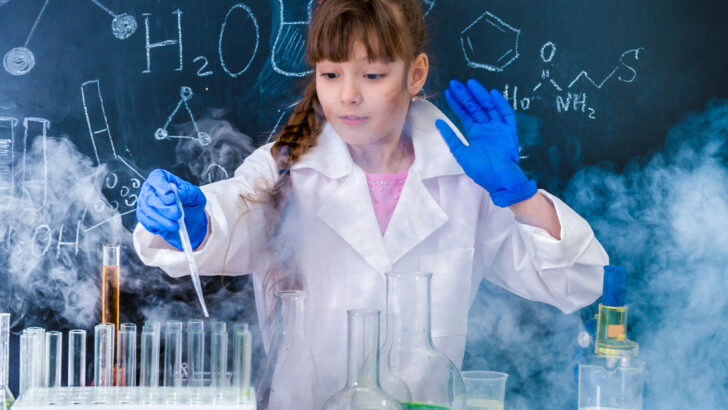 girl middle school student working on chemistry experiment