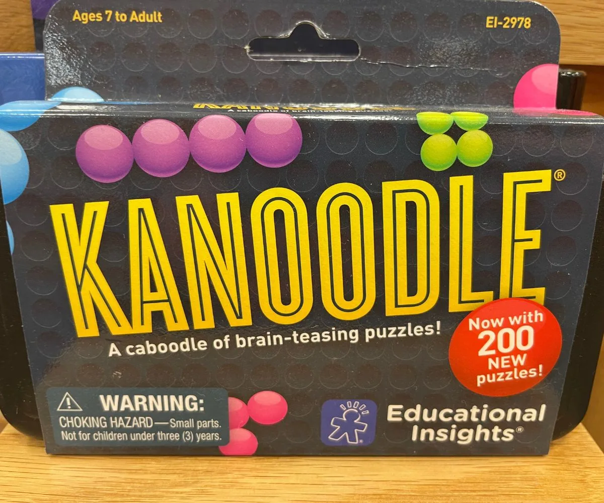 black and purple, green, pink, blue Kanoodle brain-teasing puzzle