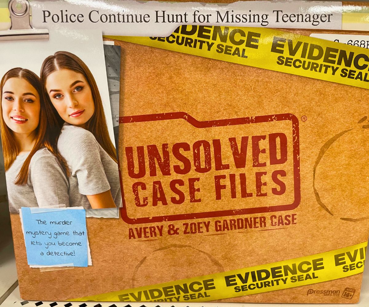 two teen girls on front of manila folder decorated crime scene cold case product