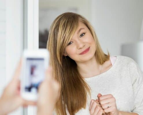 teen girl having a picture taken of her