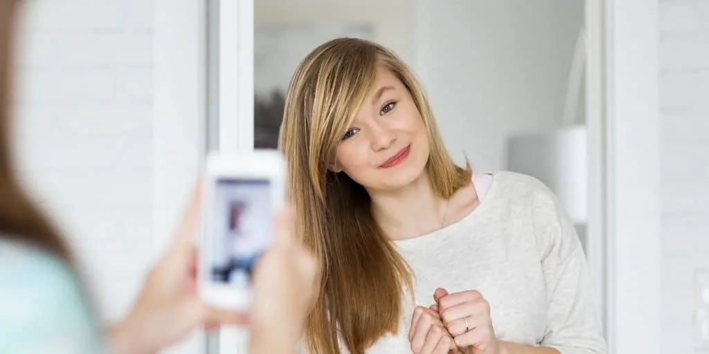 teen girl having a picture taken of her