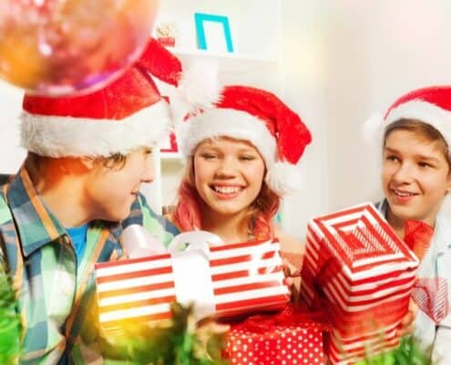 group of kids and teens with money gifts they're excited to open