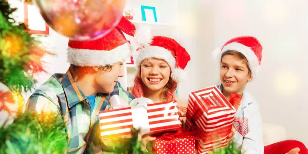 group of kids and teens with money gifts they're excited to open