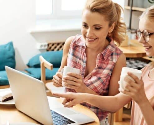 mother with her teenage daughter, looking at scholarships, awards, and competitions for young entrepreneurs