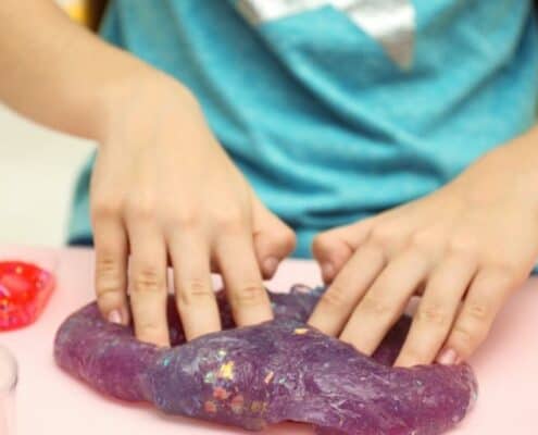 tween kid making slime as part of market day lesson plan