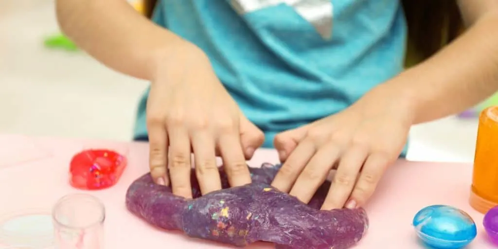 tween kid making slime as part of market day lesson plan