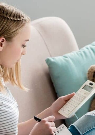 teen student sitting on couch working on goal setting worksheets for teens pdf