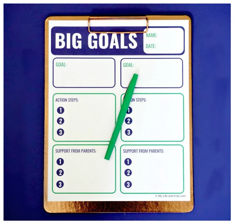 Screenshot of big goals downloadable worksheet for teens on navy blue background with green pen