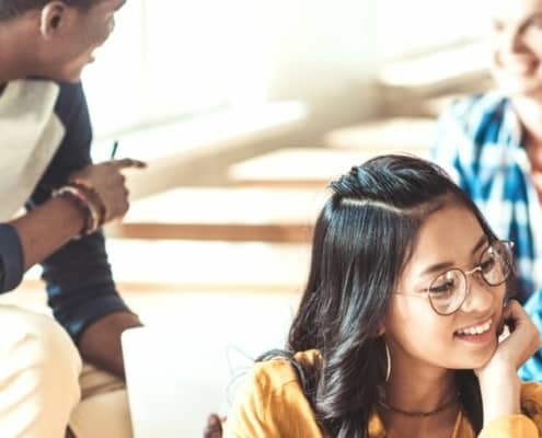 group of high school students playing free financial literacy games