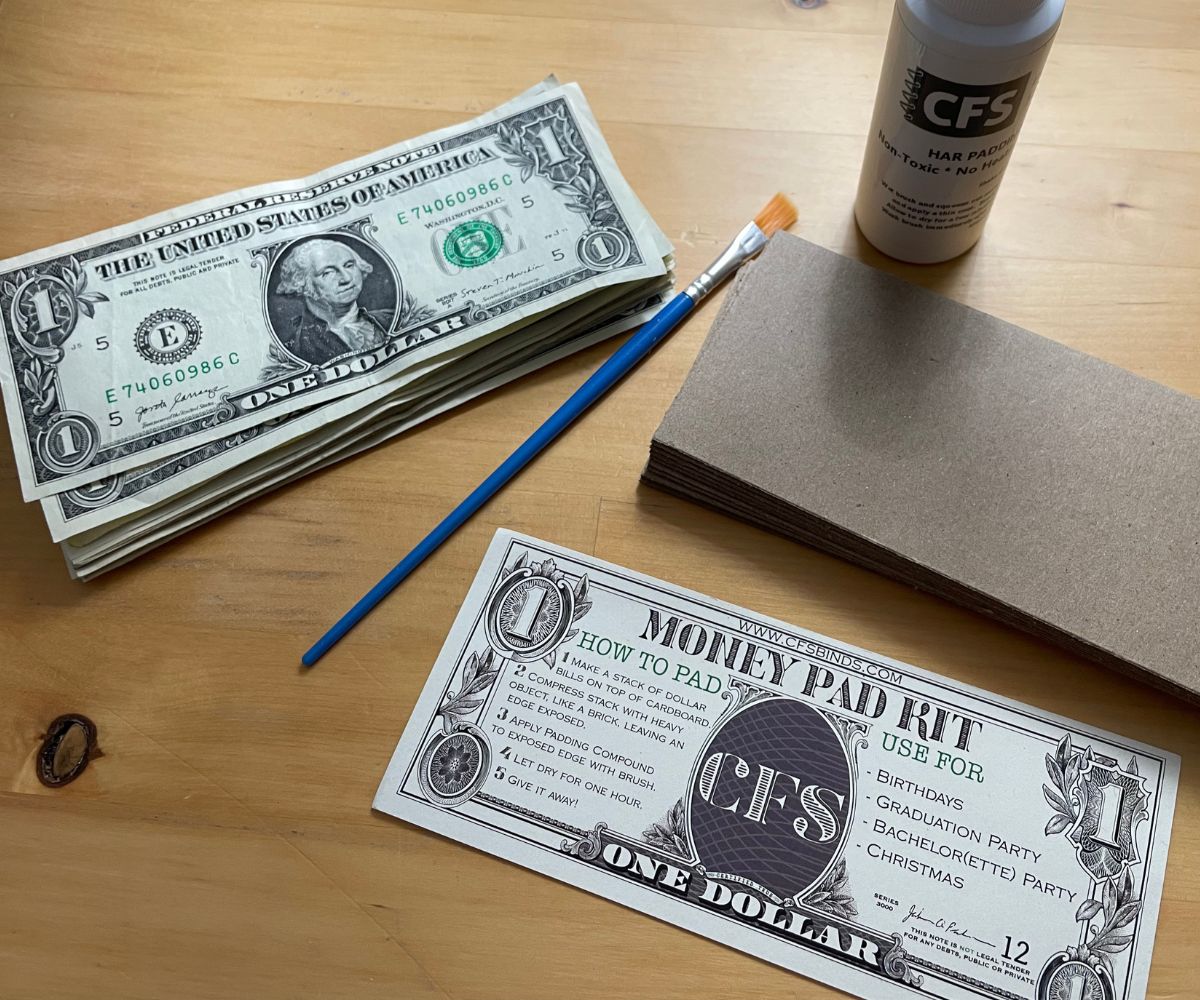 money notepad kit with brush, glue, and cardboard pieces