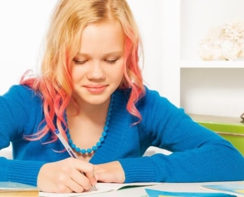 tween having fun at desk with money game printable for kids