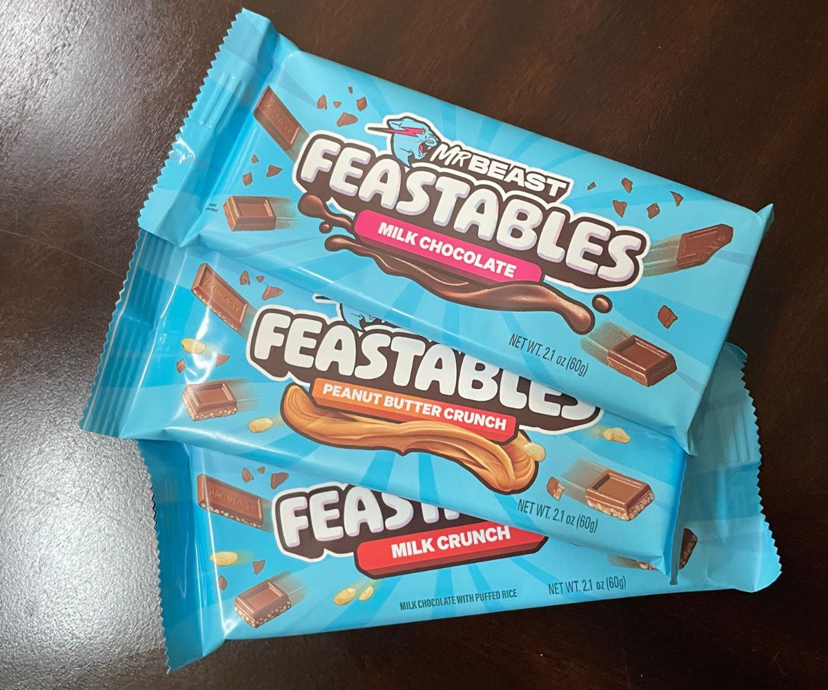 3 bars of Mr Beast Feastables chocolate on dark table
