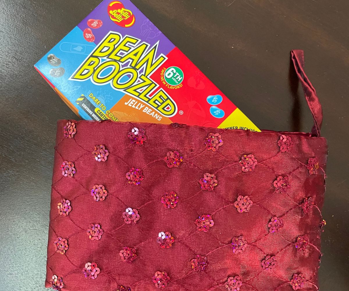 box of Bean Boozled Jelly Beans game sitting inside red stocking