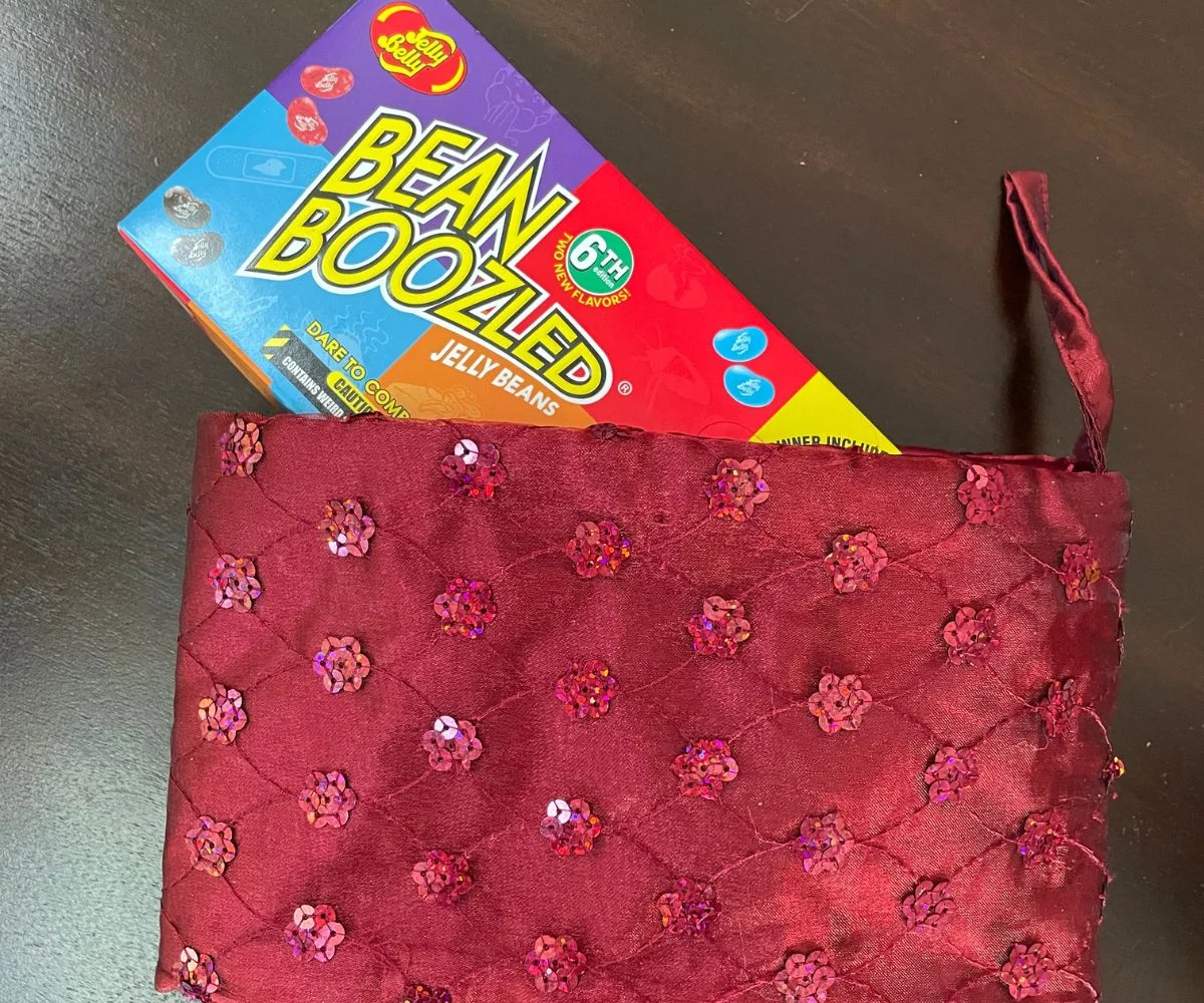 box of Bean Boozled Jelly Beans game sitting inside red stocking