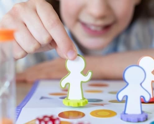 girl child playing a budgeting game for youth printable