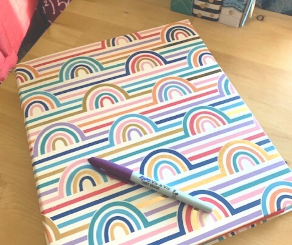 screenshot of rainbow binder with productive after school routine inside, and wet erase marker