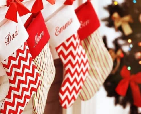family stockings along the mantel filled with stocking stuffer gift ideas for 18 year olds