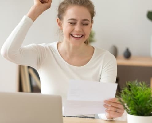 teen girl celebrating job letter - snagged jobs for high school students with no experience