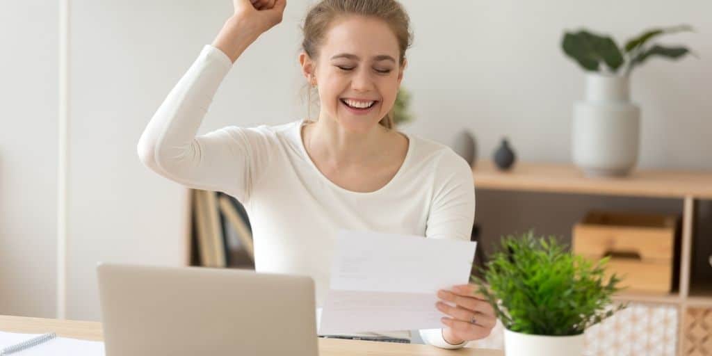 teen girl celebrating job letter - snagged jobs for high school students with no experience