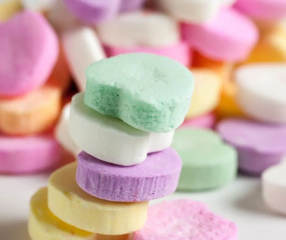 image of valentine's candy hearts stacked, part of a valentine's day activity ideas for teens