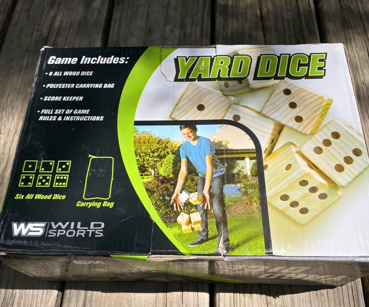 set of giant yard dice on wooden deck