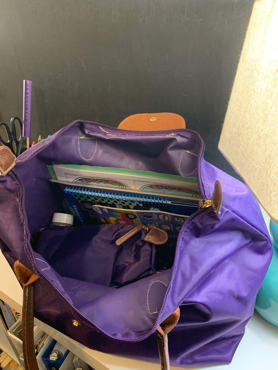 purple bag with lots of supplies in it for the car ride activities for 4 year olds