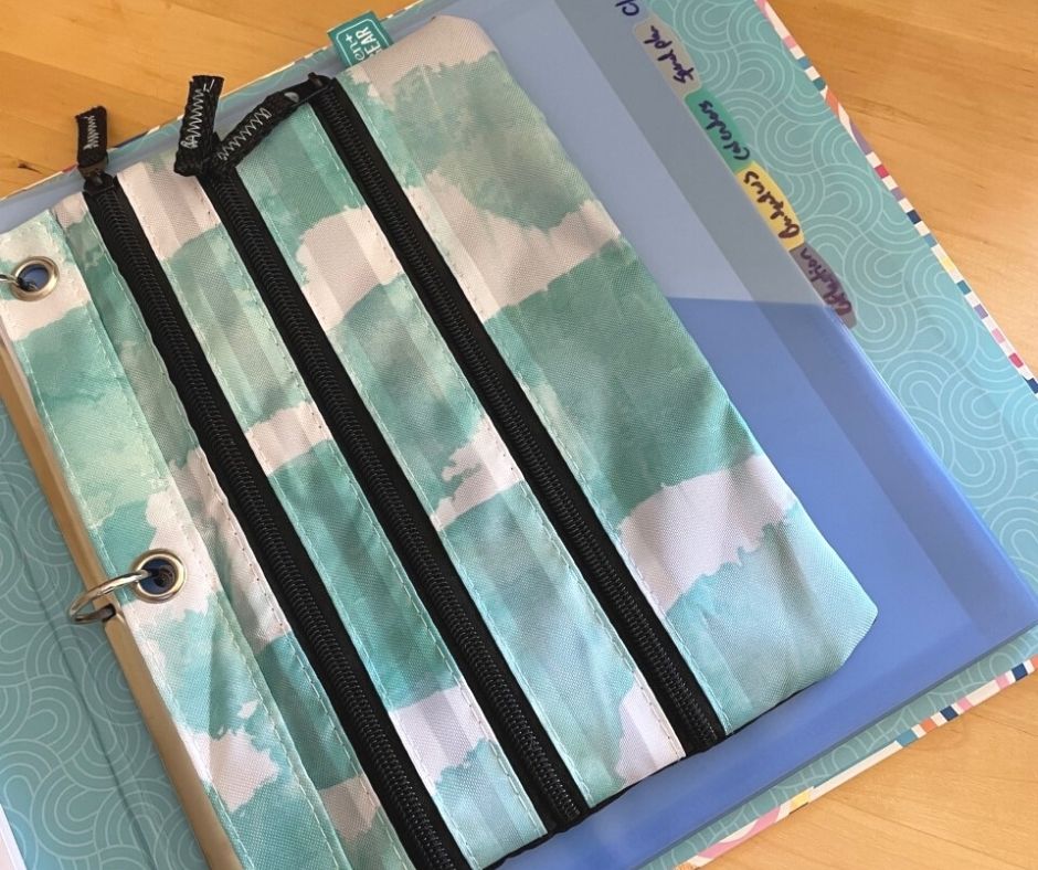blue tie-dye pouch in front of teen budget binder