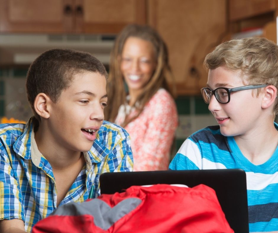 two teen boys, 12 years old, talking at a sleepover