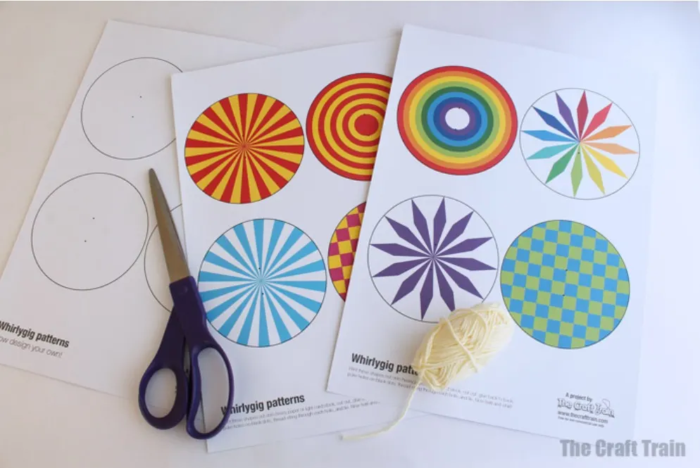 three papers with whirlygig circular patterns on white background