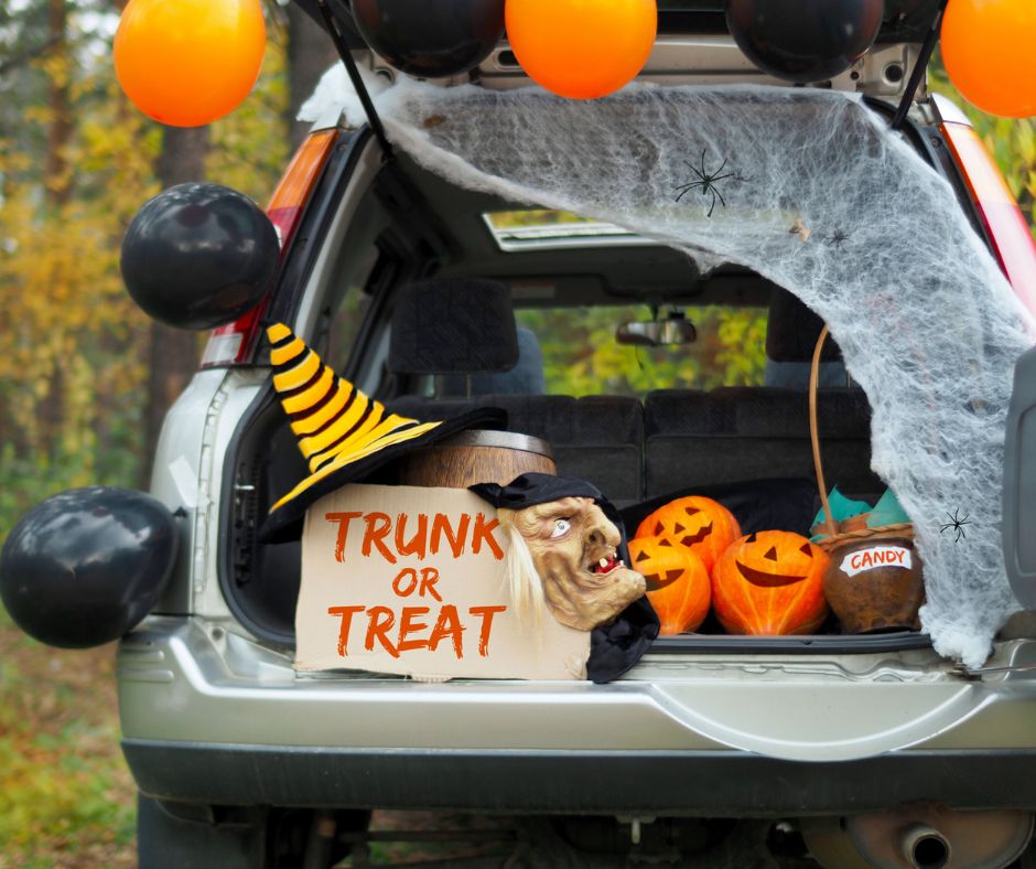 van with trunk open for trunk or treat, with halloween decorations
