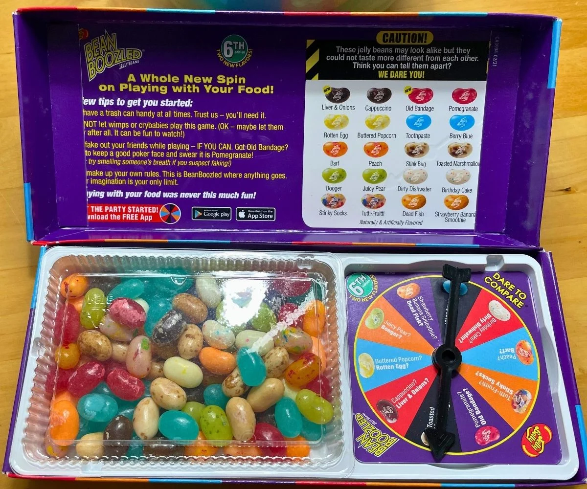 colorful Jelly Bell Bean Boozled box opened up to show lots of beans