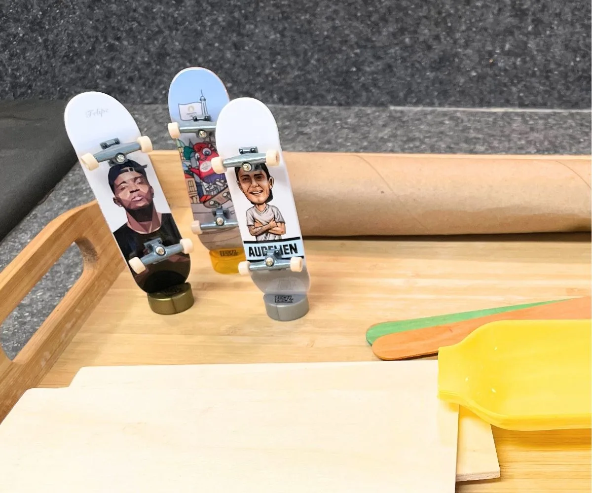 three fingerboards standing up on little stands