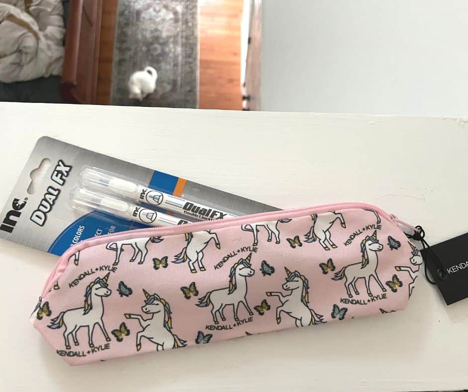 pink unicorn Kendall pencil case with dual-colored pens sticking out