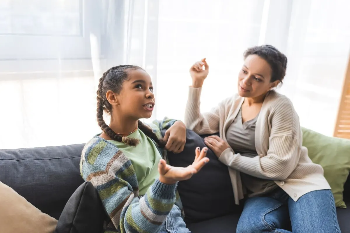 teen negotiating chores with mother on couch