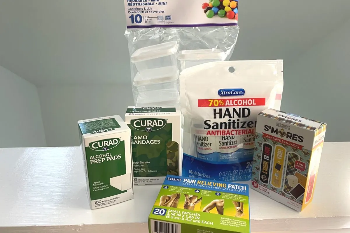 group of first aid products from Dollar Tree like bandaids, hand sanitizer packages, etc.