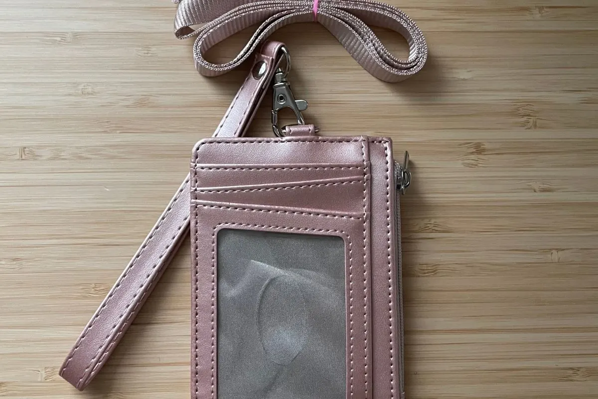 pink sheen wallet showing ID slot and wristlet/lanyard