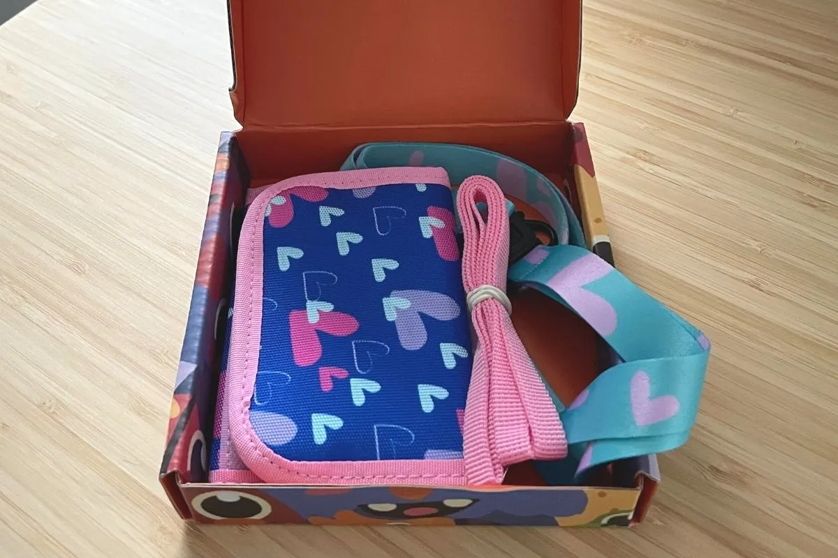 pink bordered, blue with hearts wallet with lanyard in box