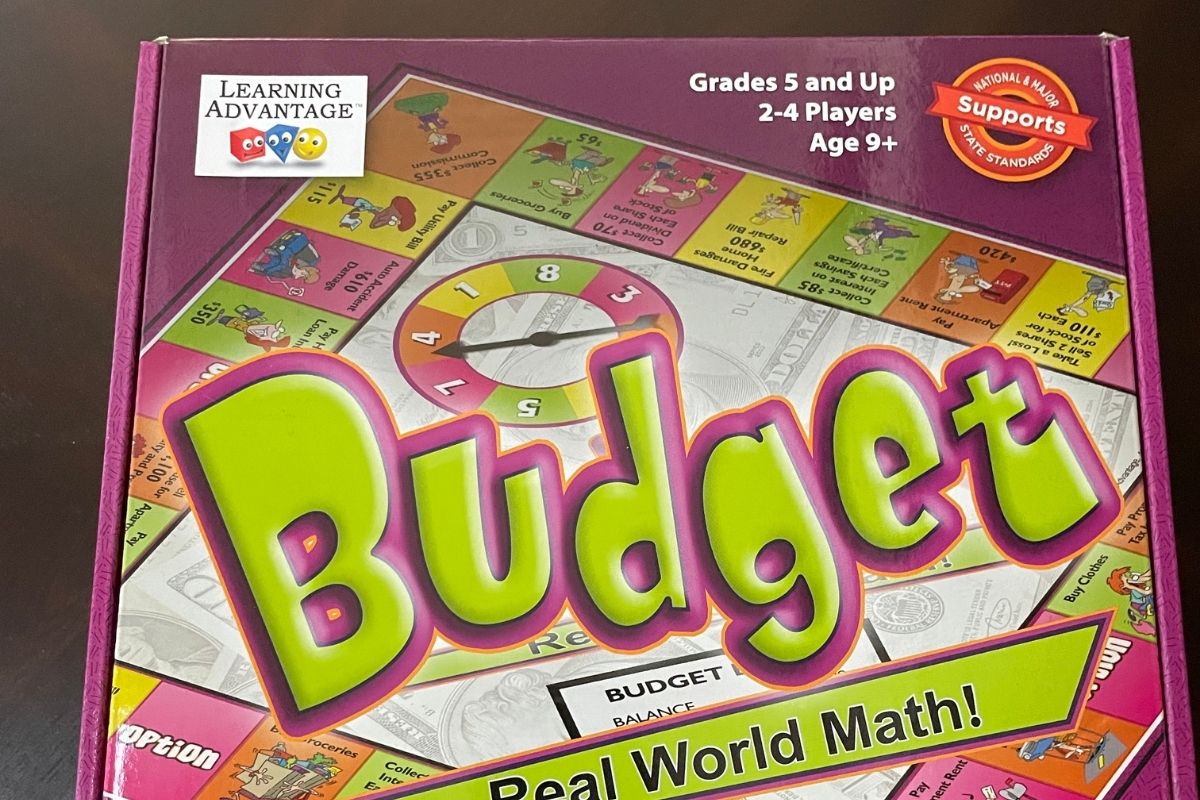 purple and neon green real world math board game cover