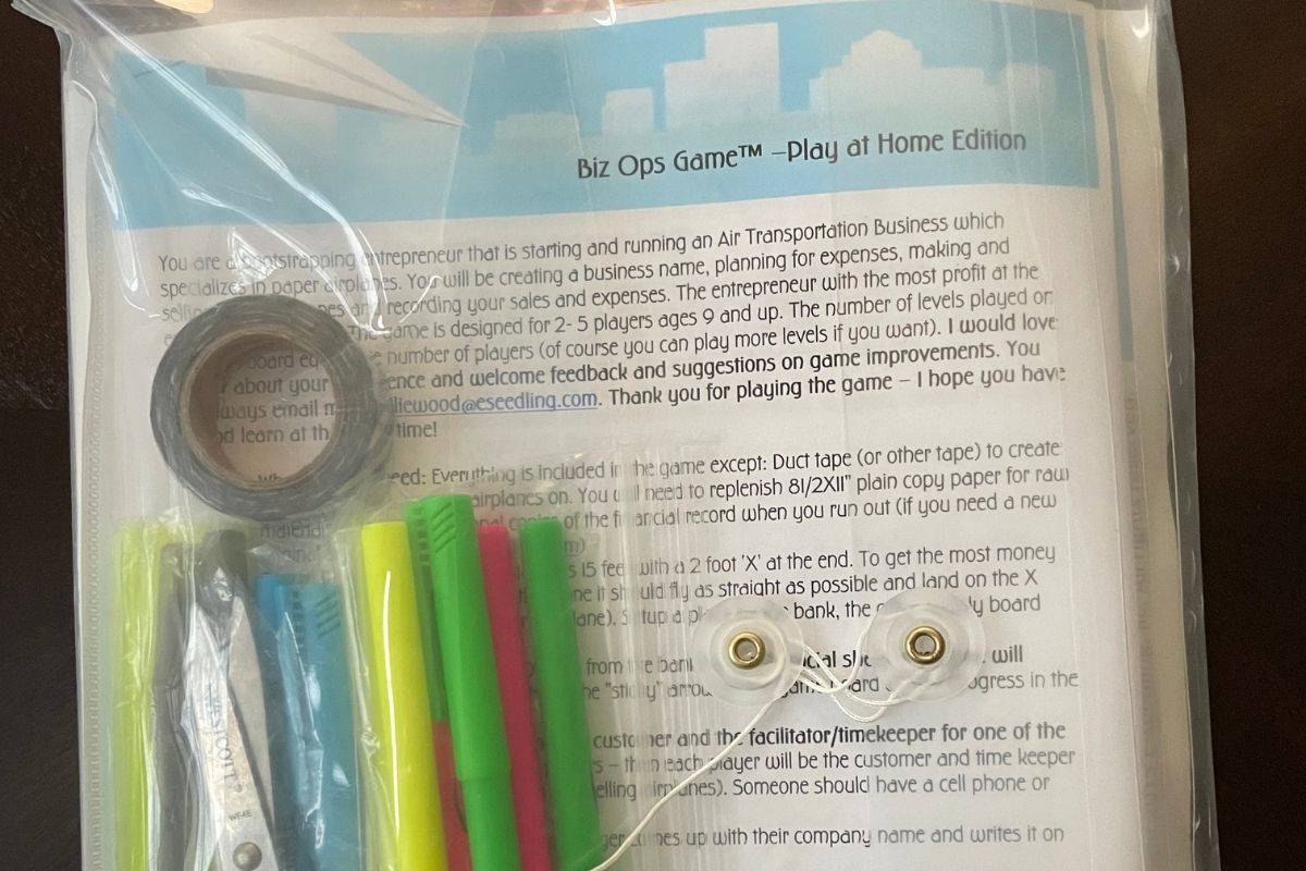 lots of highlighters, scissor, and tape in a clear envelope with instructions