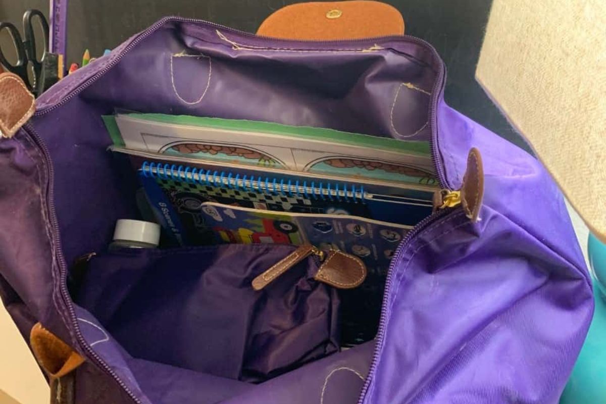 purple bag with lots of supplies in it for the car ride activities for 4 year olds